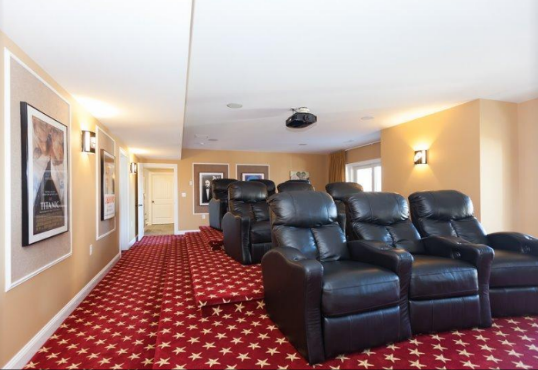 Lay back and recline in this East Sandwich home in an incredible lower-level home theater