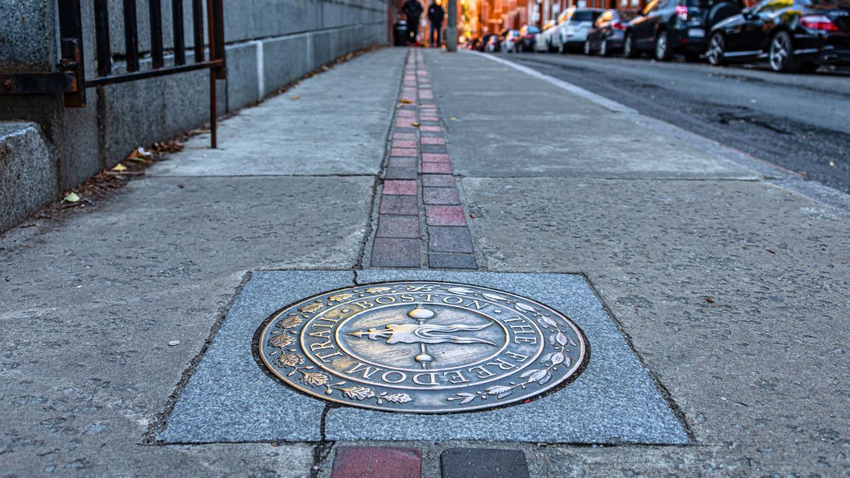 Freedom Trail marker on a sidewalk in Boston