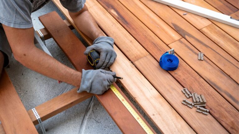 A man building a deck/patio
