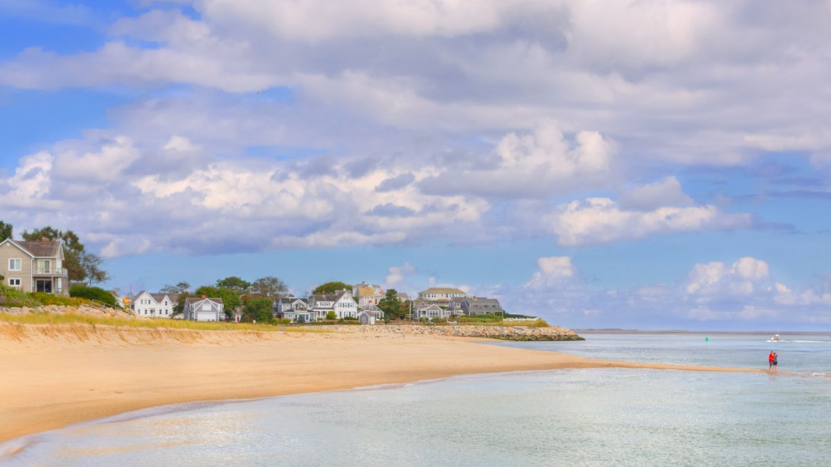 Calm beach with coastal homes on the Lower Cape