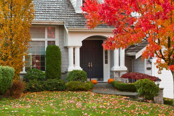 Massachusetts home with colorful fall foliage and seasonal curb appeal