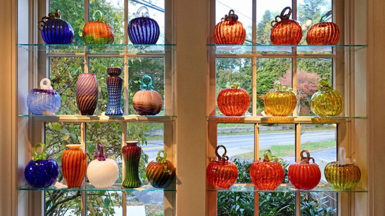 Handcrafted glass pumpkins displayed at Sandwich Glass Museum on Cape Cod