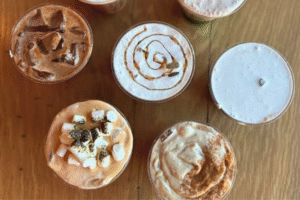 Shot from above of South Boston Pumpkin S'mores latte and other fall inspired beverages- at Cannon Ball Cafe