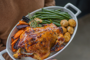Thanksgiving meal on a serving plate with vegetables and potatoes