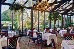Dining room with large windows at The Dan’l Webster Inn & Spa – Sandwich