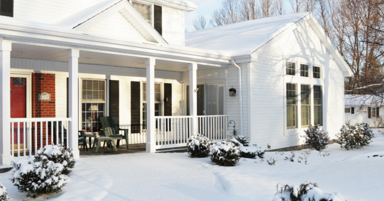 New England home covered in snow after a winter storm