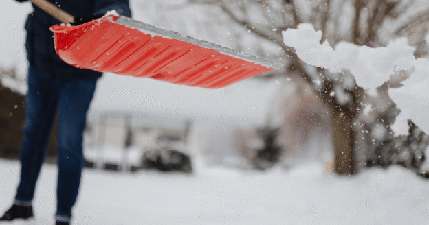 Person shoveling snow after a winter storm