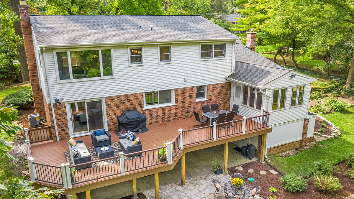 multi-level home with large deck and wooded backyard
