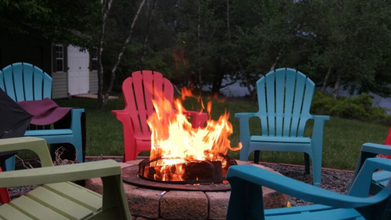 fire pit with Adirondack chairs