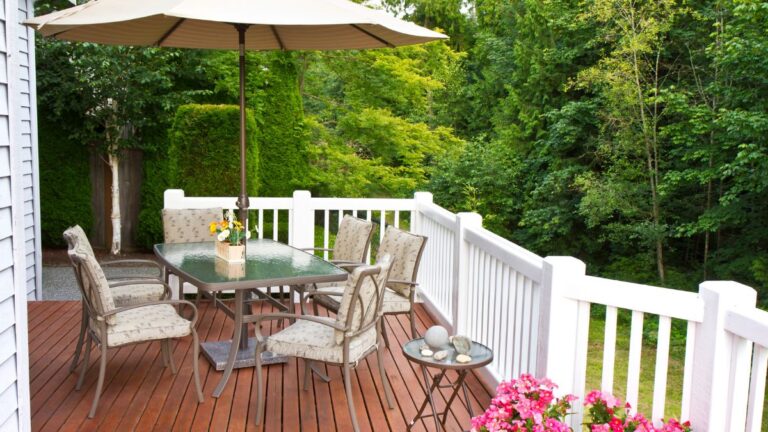 Outdoor dining table and chairs on deck