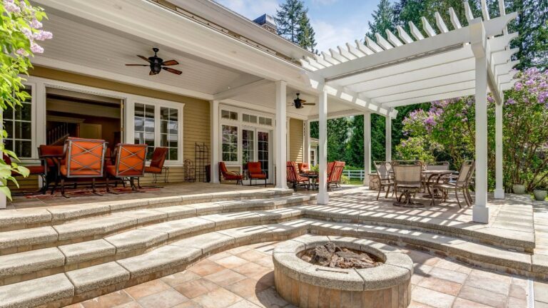Outdoor patio with pergola, fire pit, and seating area