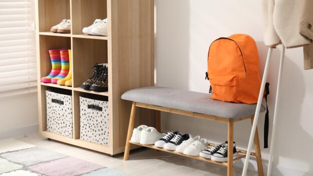 Organized entryway with backpack, bench and shoe storage for back-to-school routines