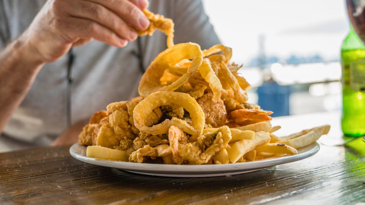 Fried clams, shrimp, fish, scallops, french fries, and onion rings