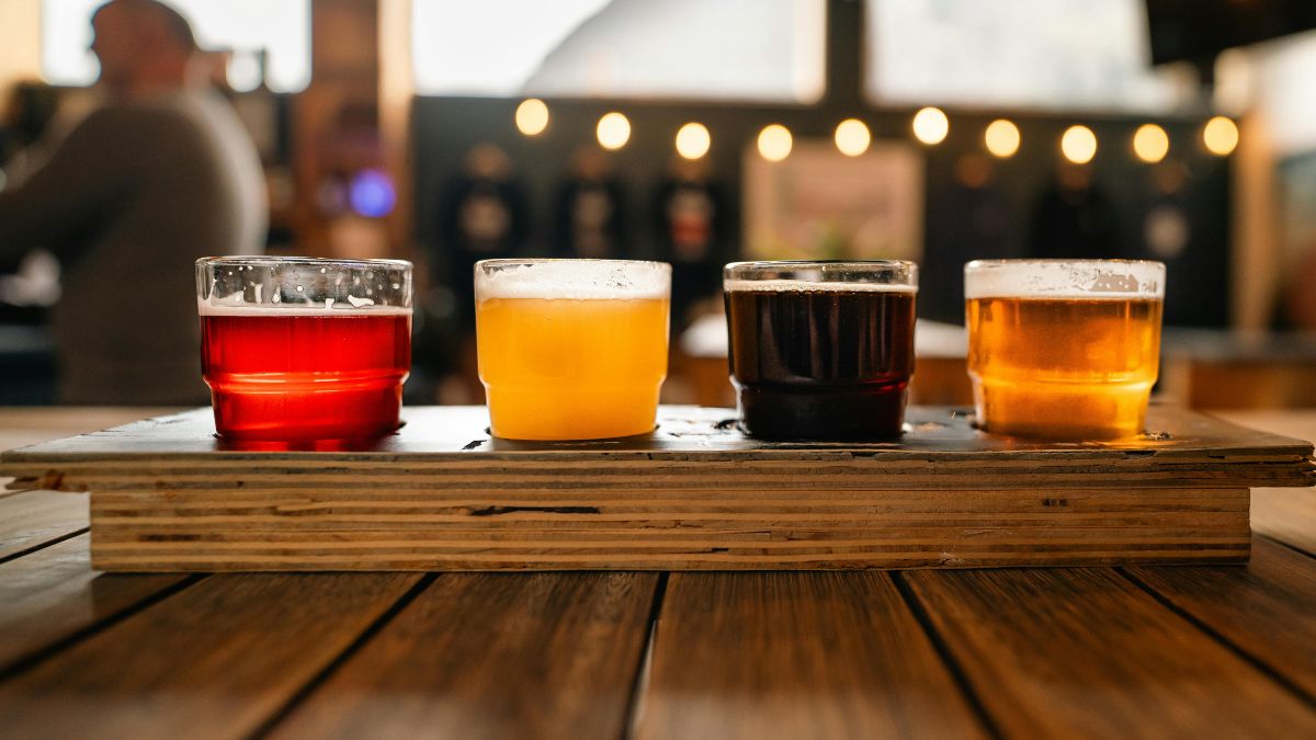 Four-glass craft beer flight at a South Coast taproom