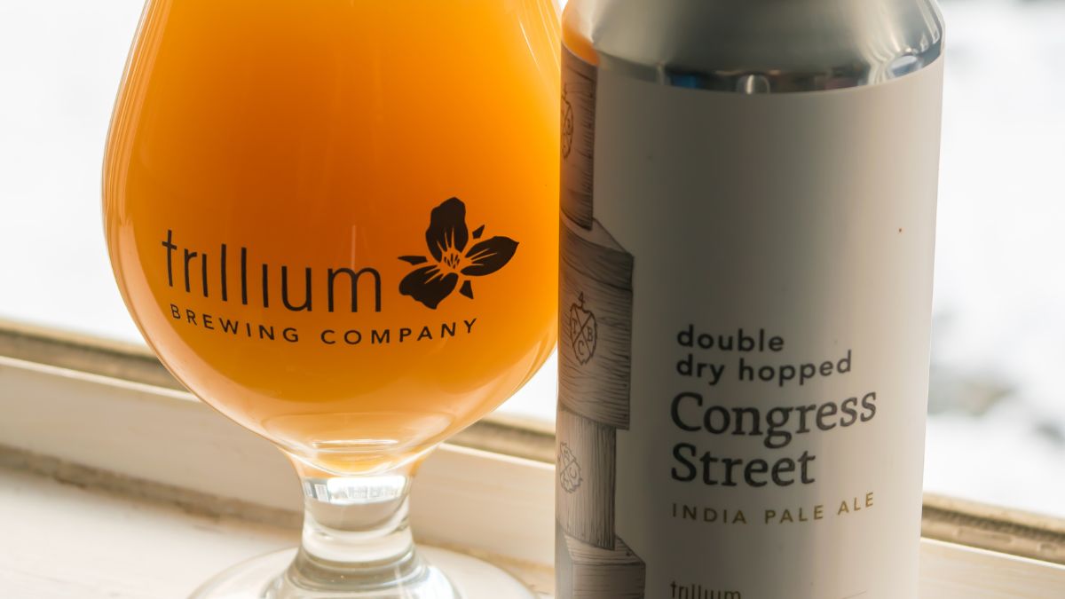 Trillium Double Dry Hopped Congress Street IPA beside a branded beer glass